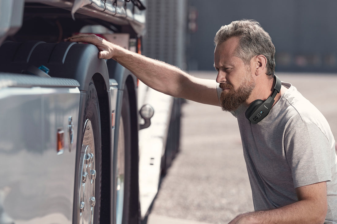 Truck driver wearing BlueParrott Bluetooth headset from MyTrucker Pro